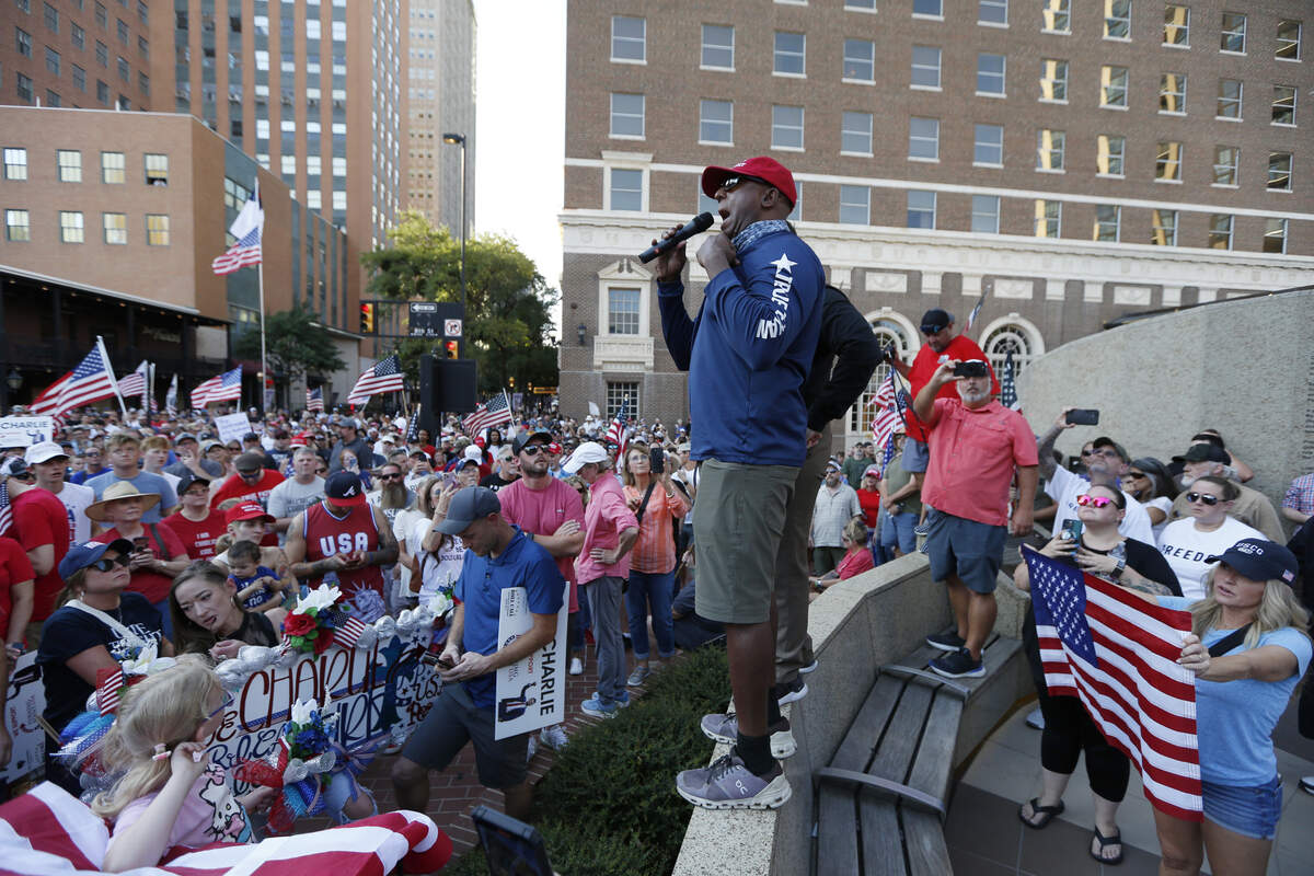 Volunteer Stephen Chacko speaks at the Kennedy Memorial during the rally to honor Charlie Kirk, Saturday, Sep. 20, 2025, in Fort Worth.