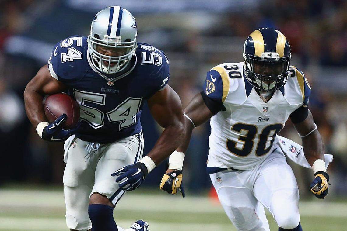ST. LOUIS, MO - SEPTEMBER 21: Bruce Carter #54 of the Dallas Cowboys returns an interception for a touchdown against Zac Stacy #30 of the St. Louis Rams in the fourth quarter at the Edward Jones Dome on September 21, 2014 in St. Louis, Missouri. The Cowboys beat the Rams 34-31. (Photo by Dilip Vishwanat/Getty Images)