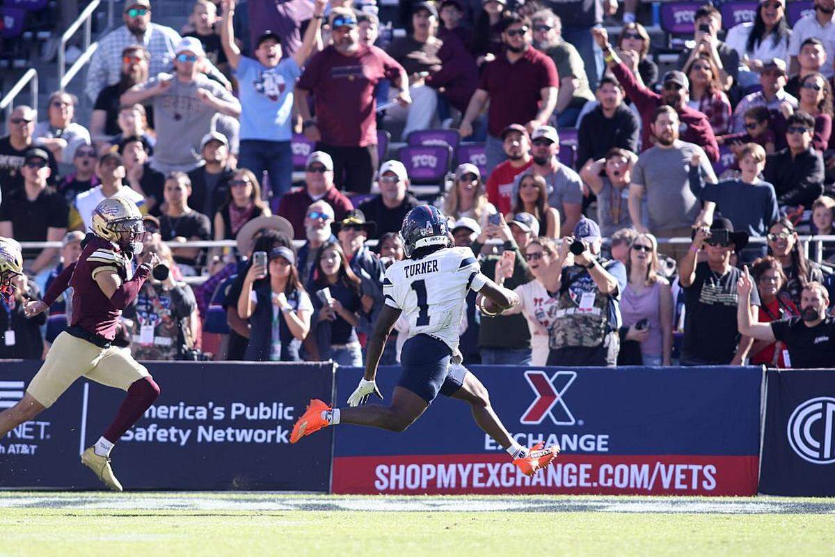 FORT WORTH, TEXAS - JANUARY 02: Aaron Turner #1 of the Rice Owls scores a touchdown against the Texas State Bobcats during the first half of the 2026 Lockheed Martin Armed Forces Bowl at Amon G. Carter Stadium on January 02, 2026 in Fort Worth, Texas. (Photo by Tim Heitman/Getty Images)