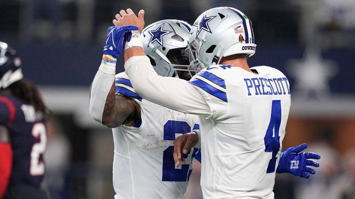 Dallas Cowboys running back Ezekiel Elliott (21) celebrates with quarterback Dak Prescott (4) after scoring a touchdown during the 2022 season. Will they be on the field together in the 2023 season?
