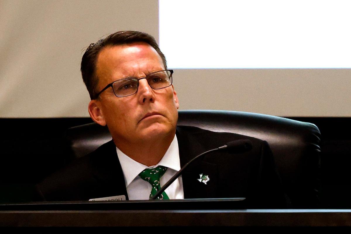 Superintendent Lane Ledbetter listens to a speaker during a Carroll school board meeting on Wednesday.