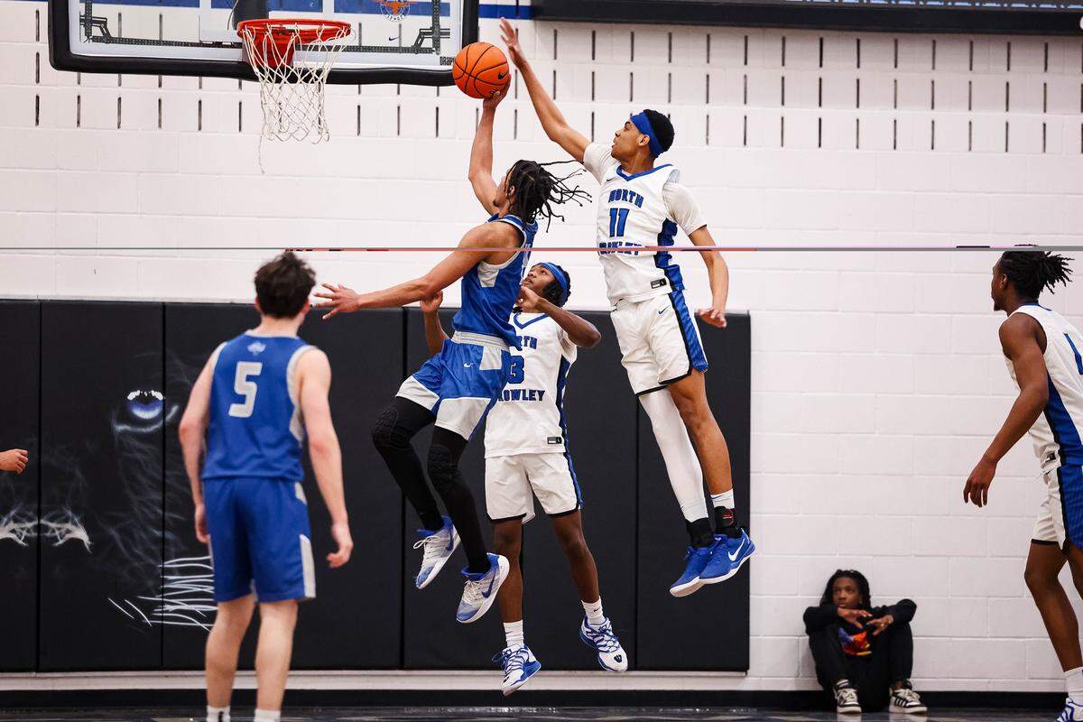 North Crowley forward Trey Hall (11) attempts to block a shot by a Weatherford player in a District 3-6A matchup Friday at North Crowley.