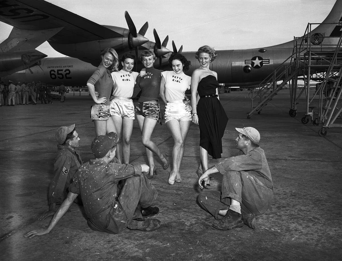 Oct. 4, 1950: “Work was virtually at a standstill on Carswell Air Base’s flight line for Sgt. James Hamilton, left, and Staff Sgt. Arthur Botten. Reason was Petty Girls Barbara Freking, Shirley Ballard, Dorothy Abbott and Mona Knox and movie star Janis Carter who visited in connection with personal appearance at the Hollywood Theater in Fort Worth.”