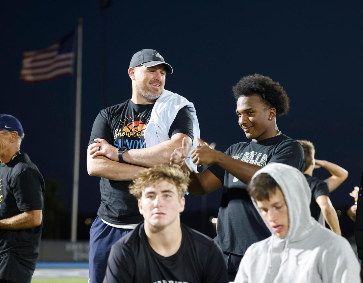 Liberty Christian head football coach Jason Witten talks with members of the team during the Showdown at Sundown outdoor exhibition volleyball game at Liberty Christian High School in Argyle, Texas, Tuesday, Oct. 29, 2024.