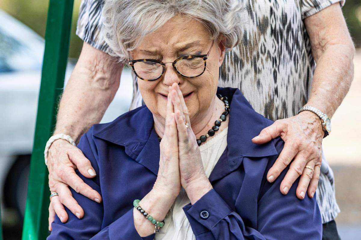 Elizabeth Joyce, the fiancé Max Wiesen, becomes emotional as her life-long friend Barbara Cole reads a poem in memory of Wiesen during his memorial service at Roselawn Memorial Park in September. Wiesen died July 27 in his home after his air conditioning unit broke in the middle of a record heat wave in North Texas.