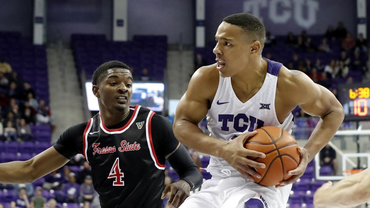 TCU guard Desmond Bane (1), who scored a team-high 23 points, shoots in front of Fresno State guard  Braxton Huggins (4) during the first half of the Horned Frogs’ victory Thursday night.