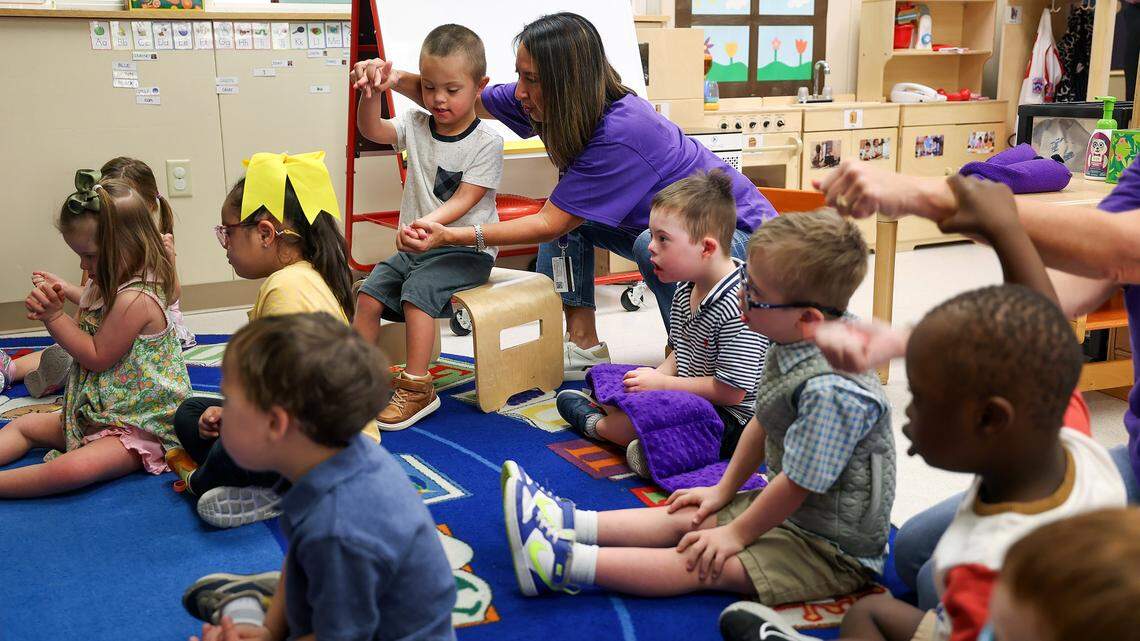 Children at KinderFrogs School on the campus of Texas Christian University sign together during class on Wednesday, Sept. 17, 2025, in Fort Worth. KinderFrogs focuses on early intervention services for children with developmental delays such as Down Syndrome. 
