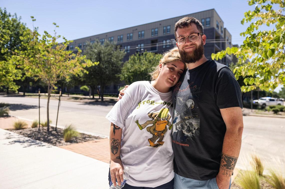The Cooper Apartments residents Astrid and Luke Walsh are photographed outside their apartment building on Tuesday, June 24, 2025, following a six-alarm fire Monday in Near Southside Fort Worth. The Walshes have lived in The Cooper for four years and plan to move elsewhere once everything is resolved.