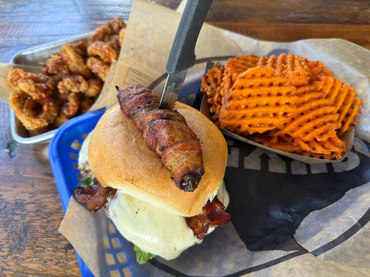 A “ jalapeño popper” bacon burger with cream cheese at the Anchor on Eagle Mountain Lake grill and bar northwest of Fort Worth, Texas, on July 15, 2025.