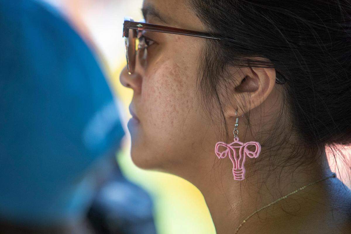 Phoebe Kingsak, 23, listens to speakers at the Bans Off Our Bodies protest outside of the Tarrant County Courthouse on Saturday, June 25, 2022. Hundreds of abortion-rights advocates gathered before marching downtown with a rallying cry of “My body, my choice.”