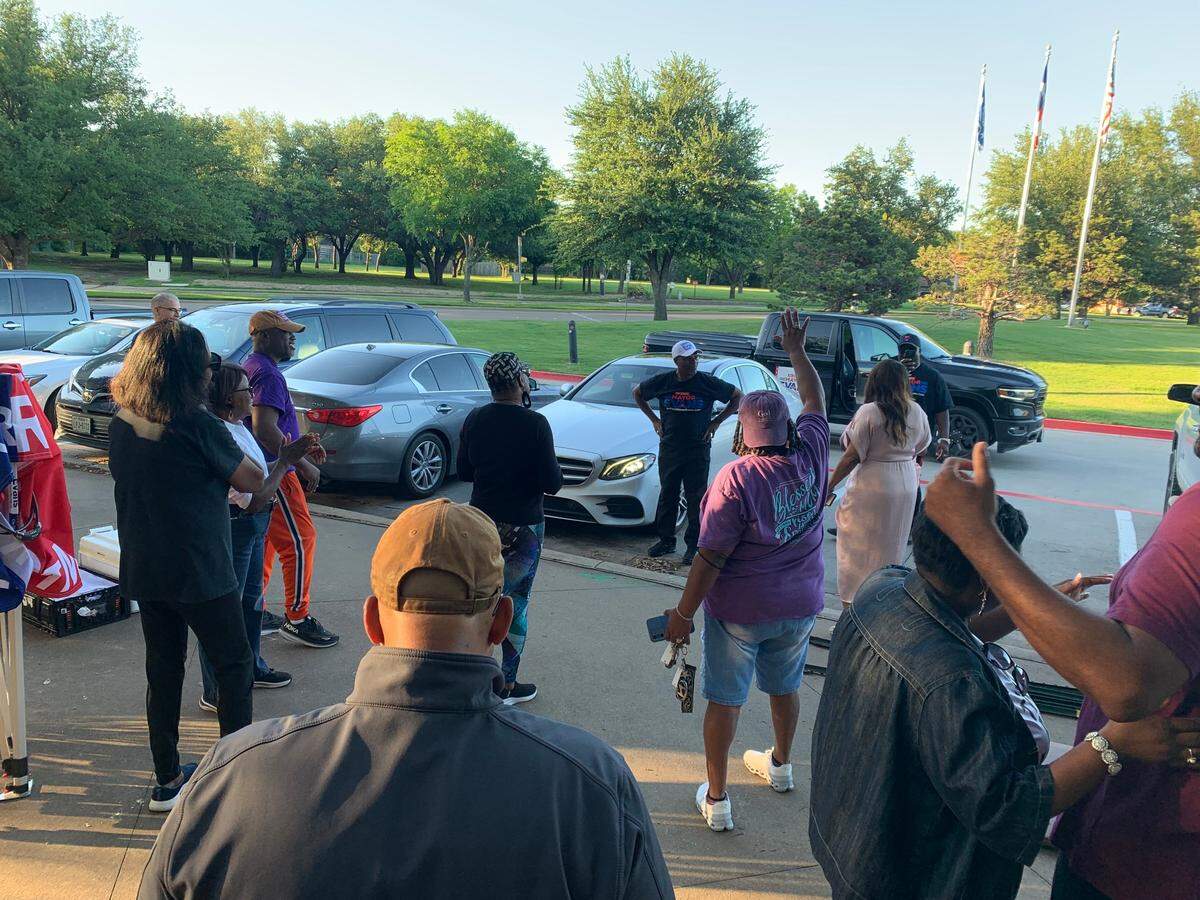 Incumbent Michael Evans greets his campaign team with a smile as they celebrate his lead in the early voting ballot count.