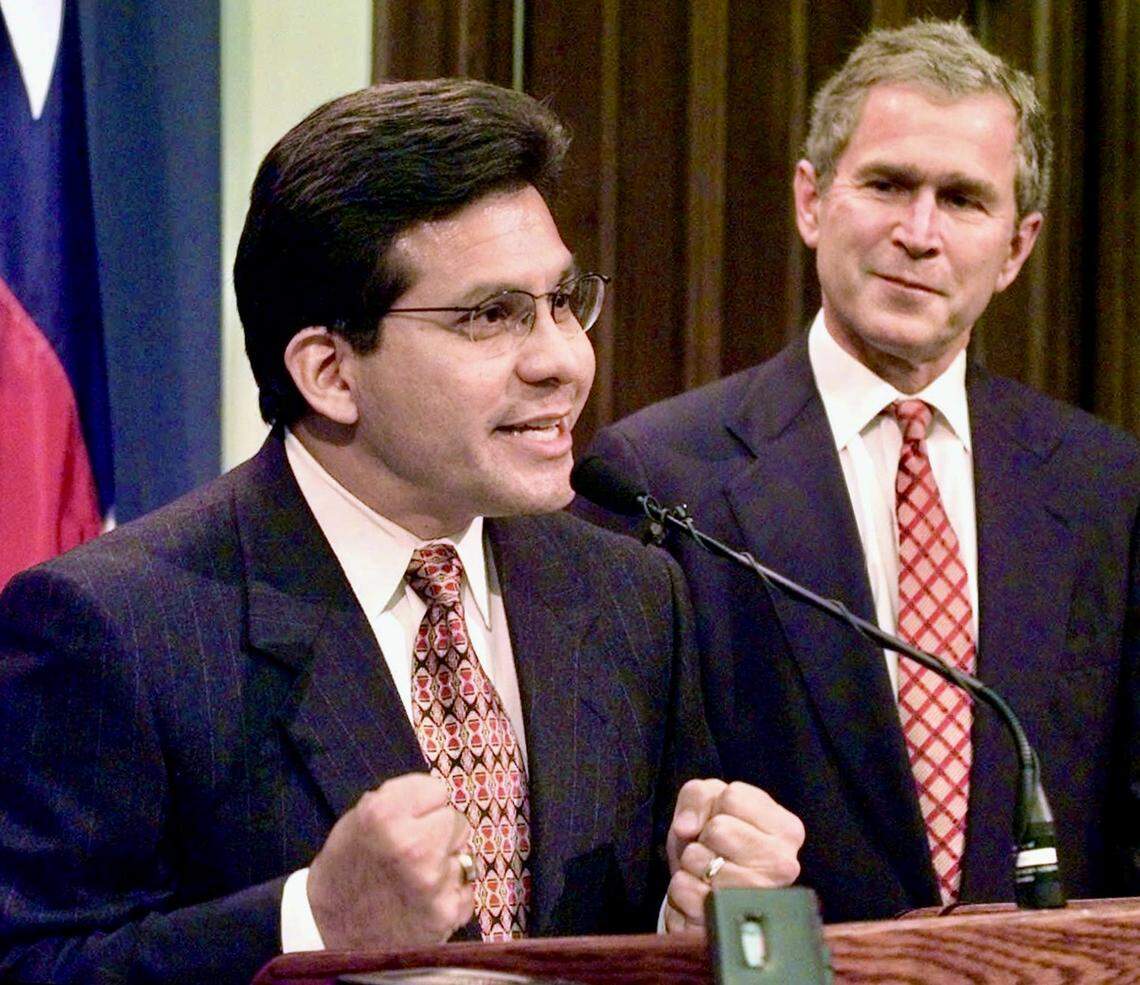 Alberto Gonzales, left, when he was named Texas Secretary of State for then-Texas Gov. George W. Bush on Dec. 2, 1997.