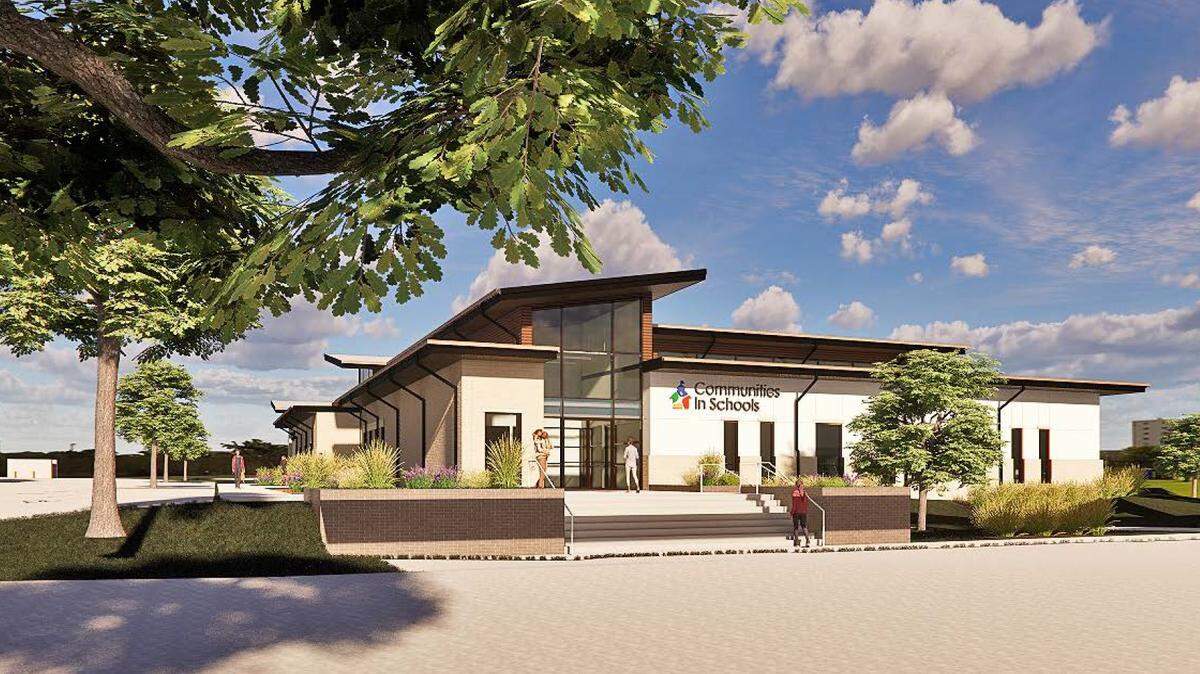 An artist's rendering of a white one-story building with a Communities in Schools logo on the front.