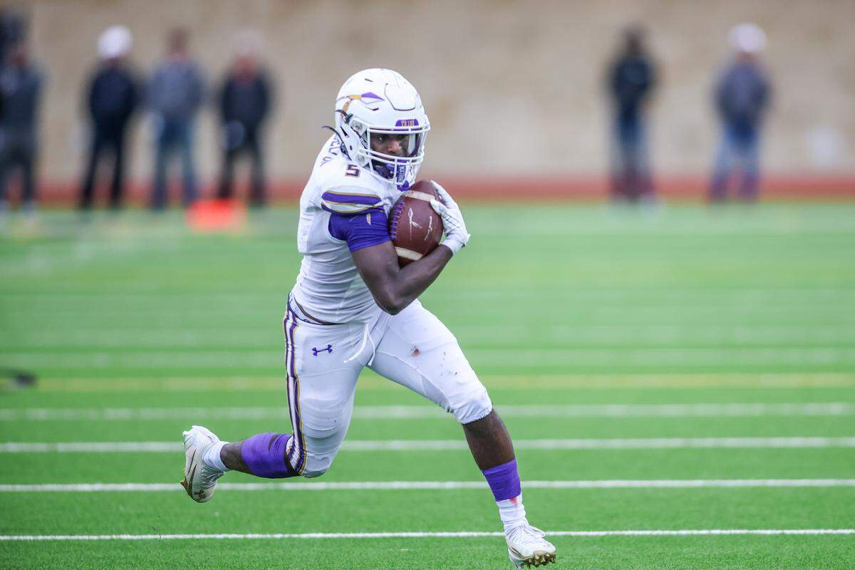 Alvarado running back Demarcus Belton gets around the end of Springtown’s defense during a Class 4A Division I regional semifinal Friday, Nov. 28, 2025, at Knight Stadium at Eagle Mountain High School in Fort Worth.