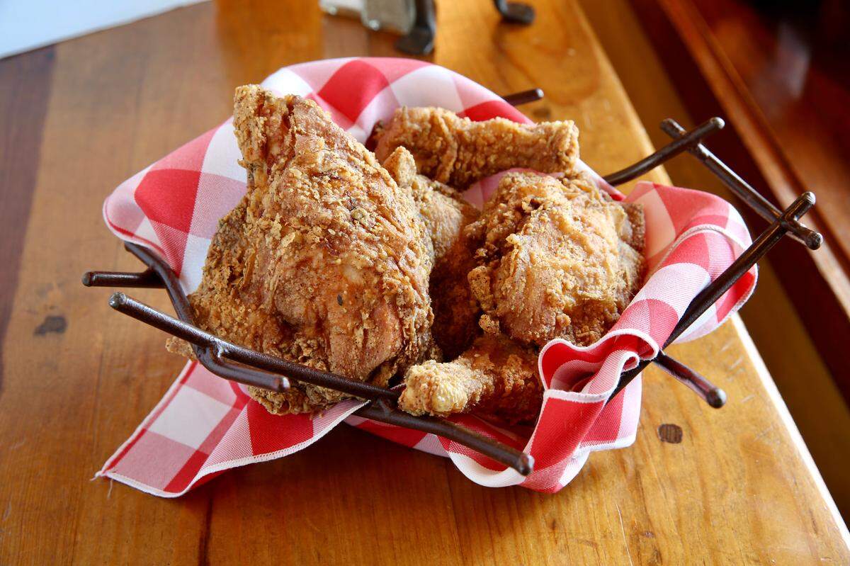Reata’s fried chicken with poblano-bacon grits is now on the daily lunch menu.