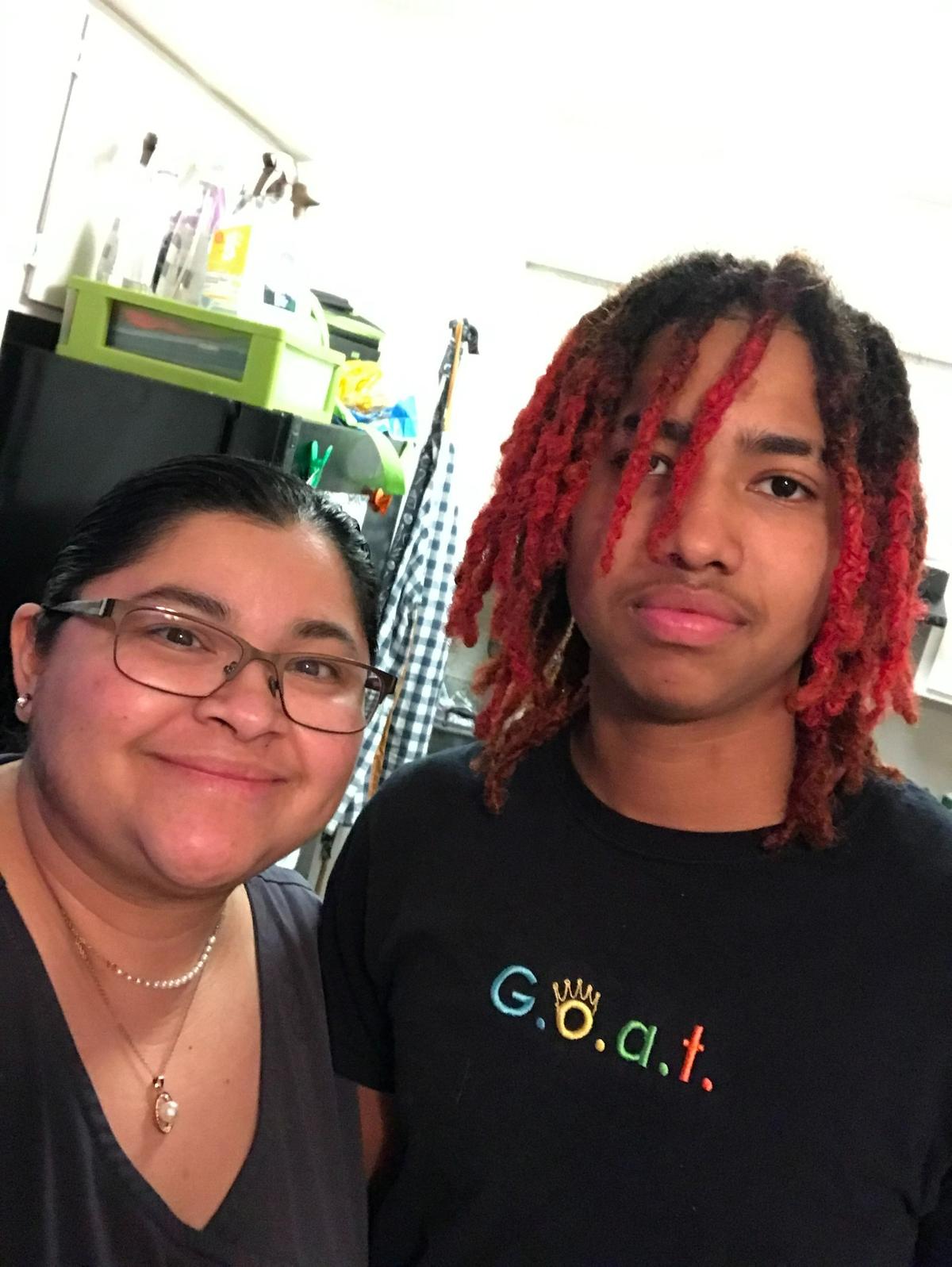 Daijhuan Jones, 16, a student at Birdville High School in North Richland Hills, was killed in a double homicide at North Park in Haltom City on Tuesday afternoon. He is pictured with his mother, Elizabeth Lopez.