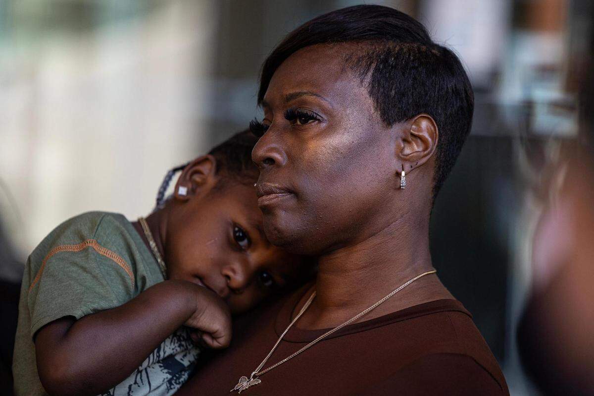 Crystal Mason carries her grandson Karter Hobbs, 3, during her press conference regarding her acquittal in a high-profile voting rights case at the Tim Curry Criminal Justice Center in Fort Worth on Friday, March 29, 2024. The Texas Second Court of Appeals reversed Mason’s conviction on Thursday evening where she had faced five years in prison for submitting a provisional ballot in Tarrant County in 2016 that was never counted as a vote.