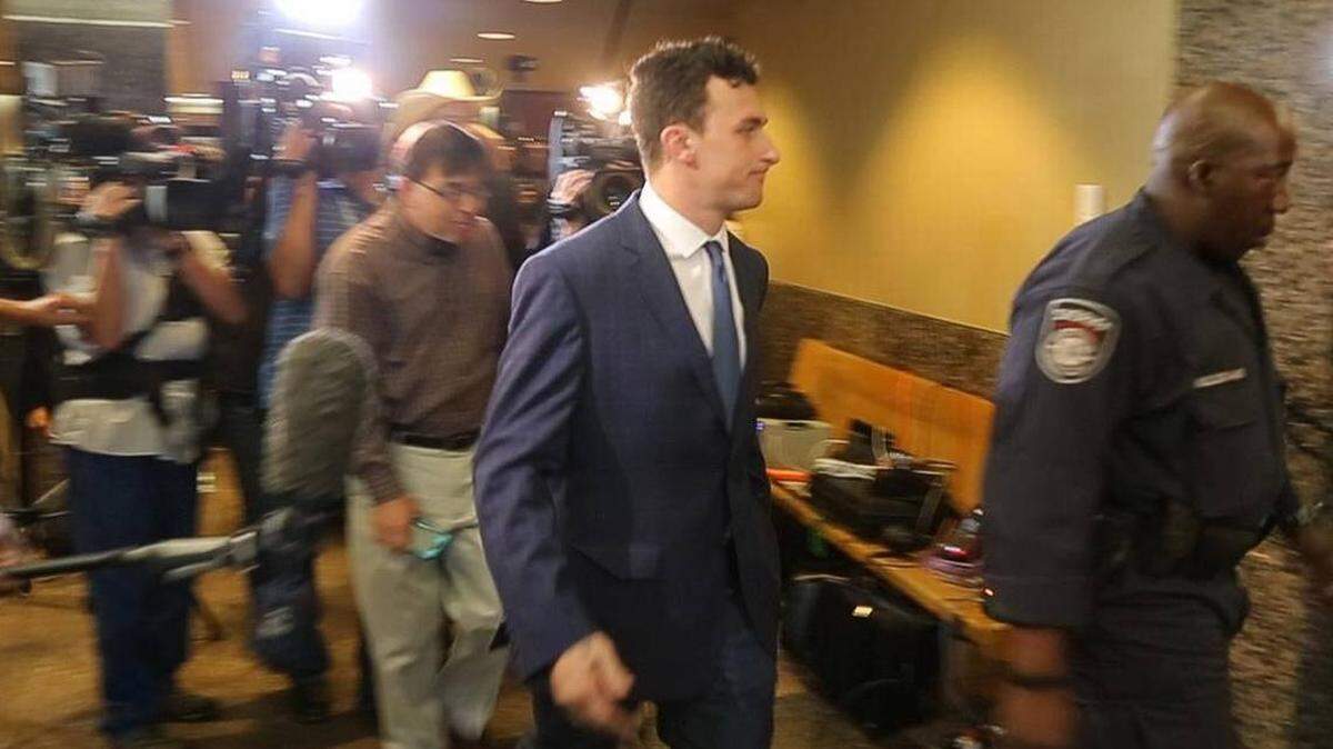 Johnny Manziel walking to court in Dallas last year for a hearing on his misdemeanor assault charge. The case has been dismissed.