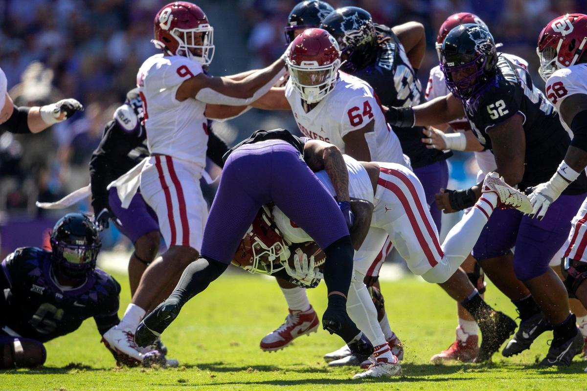 TCU safety Namdi Obiazor tackles OU running back Eric Gray at the Amon G. Carter Stadium in Fort Worth, Texas, on Saturday, Oct. 1, 2022.