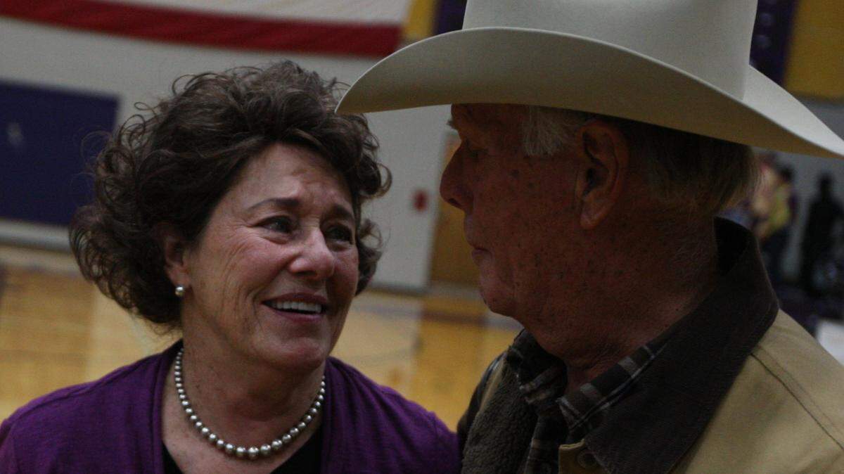 Coach Leta Andrews (left) is congratulated by her husband David after a Granbury High School girls basketball victory on December 7, 2010 in Granbury, Texas. David Andrews died Wednesday.