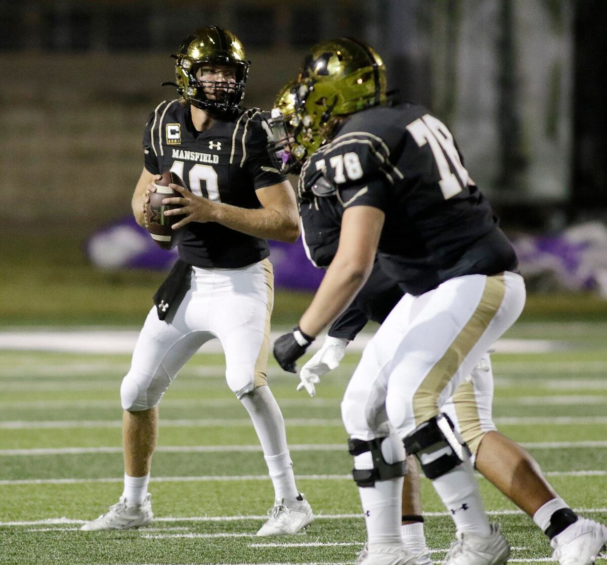 Mansfield’s Braxton Van Cleave look for a receiver 1during a UIL football game at Newsome Stadium on Saturday , October 10, 2024.