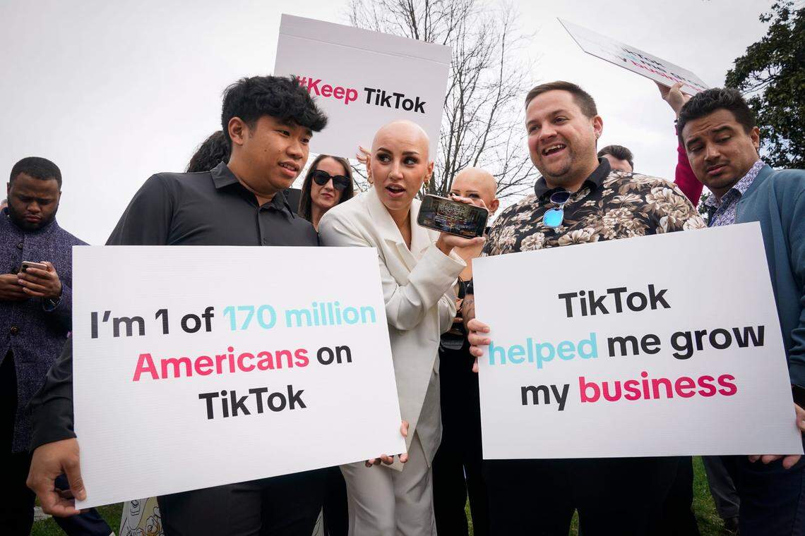 Protesters watch the vote on a TikTok ban while outside of the U.S. Capitol on March 13, 2024. The House vote was 352 for the ban and 65 against.