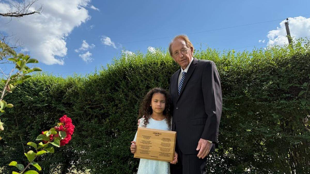 Roger Latham, with his granddaughter Sophia Gordon, wrote the poem she is holding in memory of his friend who died in a plane crash in the late 1980s. The poem has since touched the lives of many people, including members of the Blue Angels.