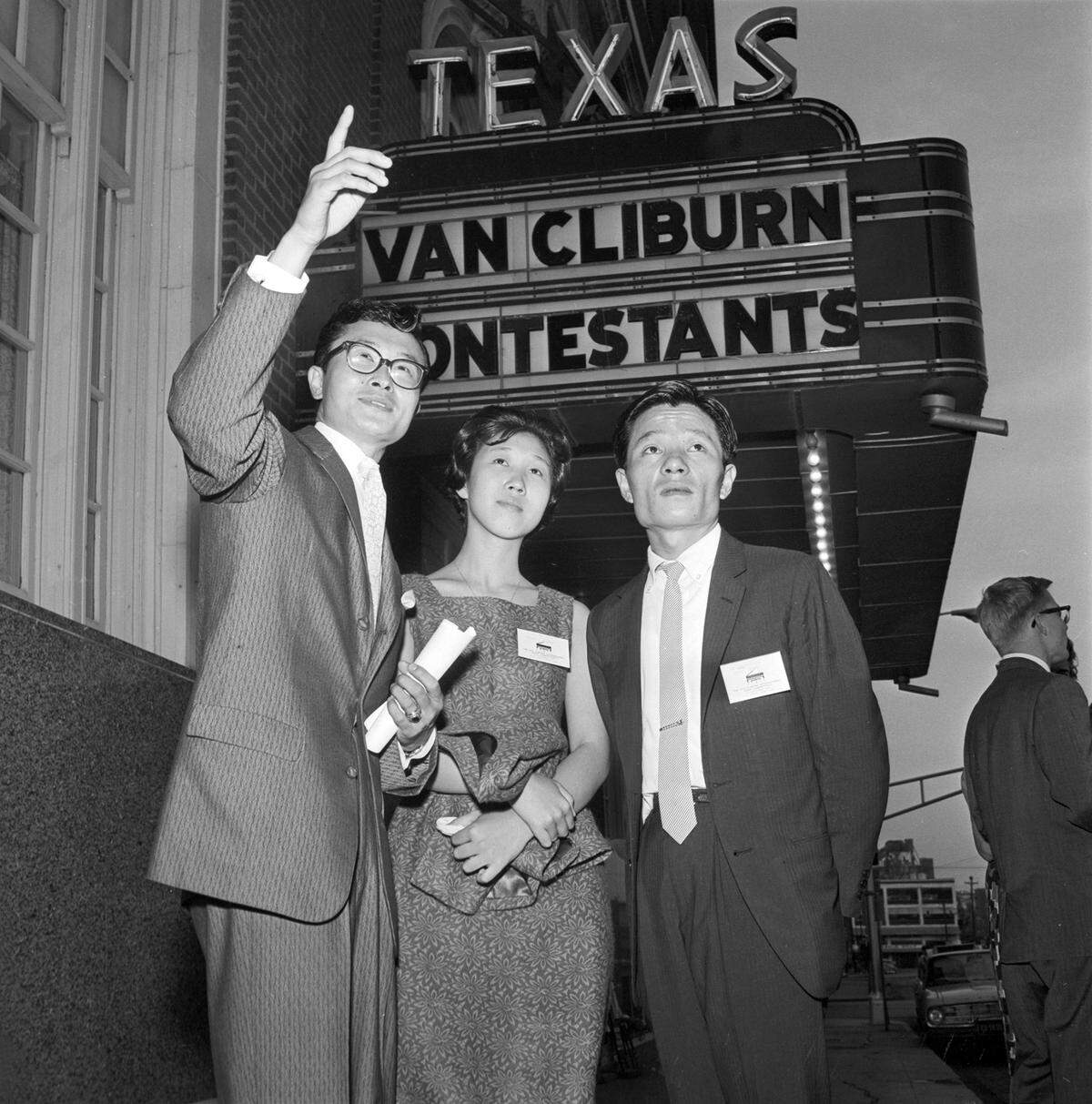 John Paik of Dallas, left, serves as an interpreter for fellow Koreans, Sung Mi Cho and Jung Kyu Kim, after arriving for the Van Cliburn International Piano Competition in 1962. The pair from Seoul were accompanied by Cho’s mother and an instructor.