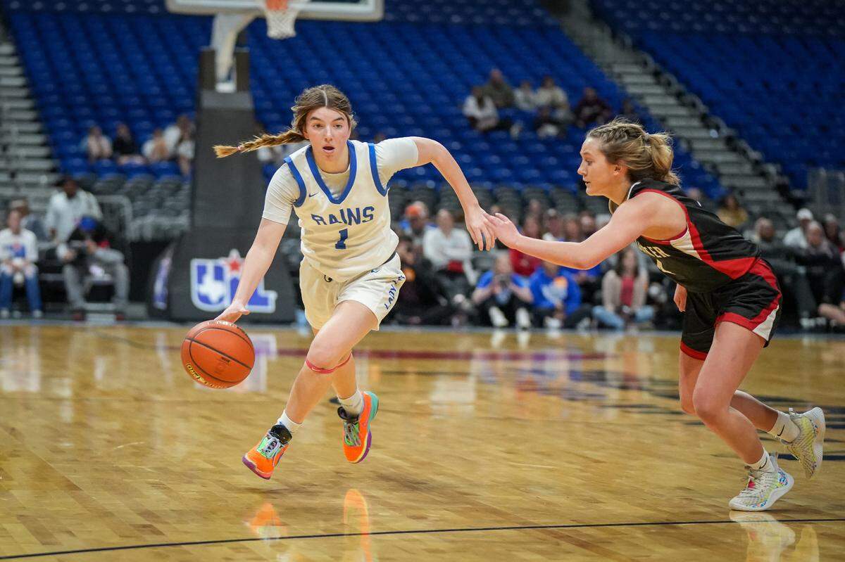 Emory Rains guard Haley Robertson (left) drives around Shallowater’s Linley Wright in a Class 3A state semifinal on Thursday, February 29, 2024 at the Alamodome in San Antonio, Texas. Shallowater upset No. 3 Rains 59-47.