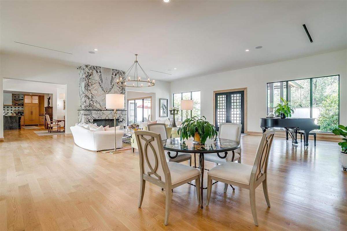 The four-bedroom, five-bathroom residence—which is listed for a whopping $14.9 million—is a 6,500-square-foot ranch-style home.