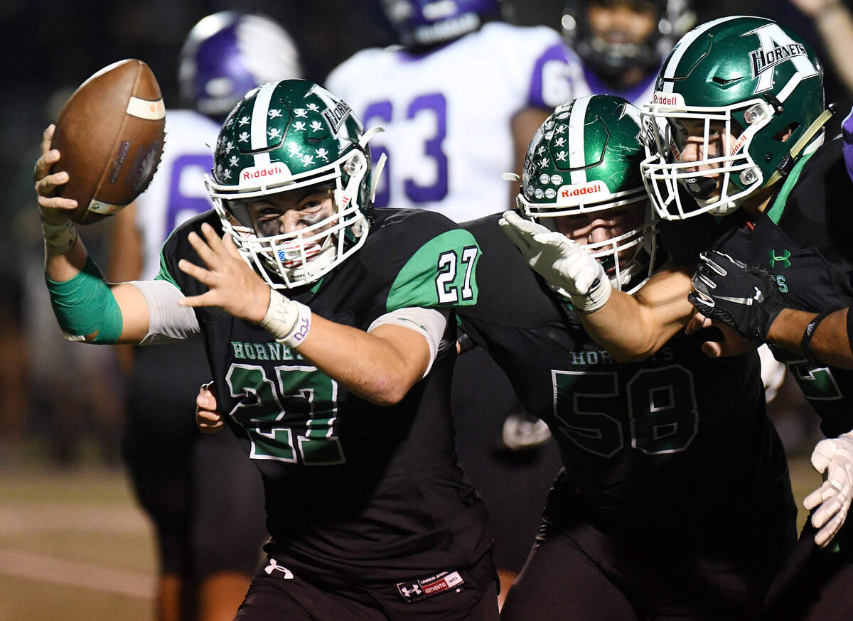 Azle’s Jesse Rivera, left celeberates with teammates Jason Lund and Chase Torgesen after recovering a Crowley fumble in thethird quarter of Friday’s October 4, 2019 football game at Hornet Stadium in Azle, Texas. Azle went on to win 48-47. Special/Bob Haynes