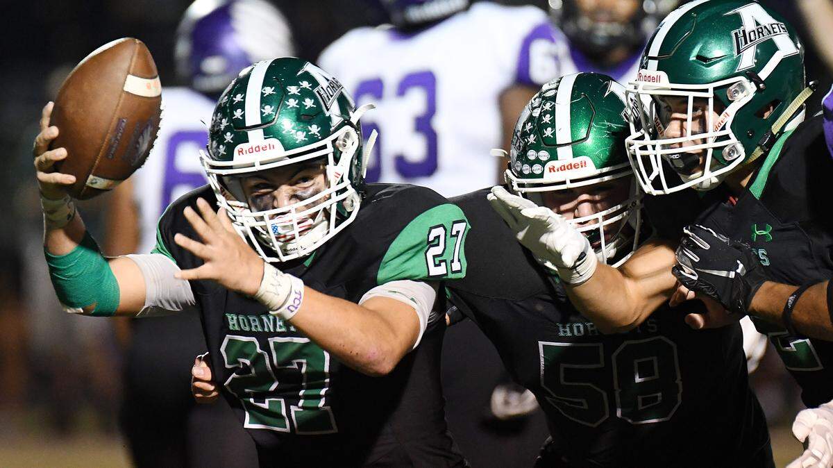 Azle’s Jesse Riveria, left celeberates with teammates Jason Lund and Chase Torgesen after recovering a Crowley fumble in thethird quarter of Friday’s October 4, 2019 football game at Hornet Stadium in Azle, Texas. Azle went on to win 48-47. Special/Bob Haynes