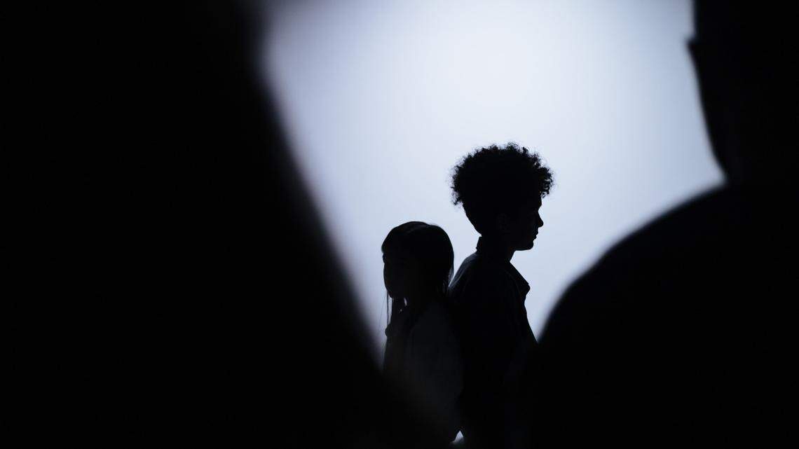 Children shown in silhouette.