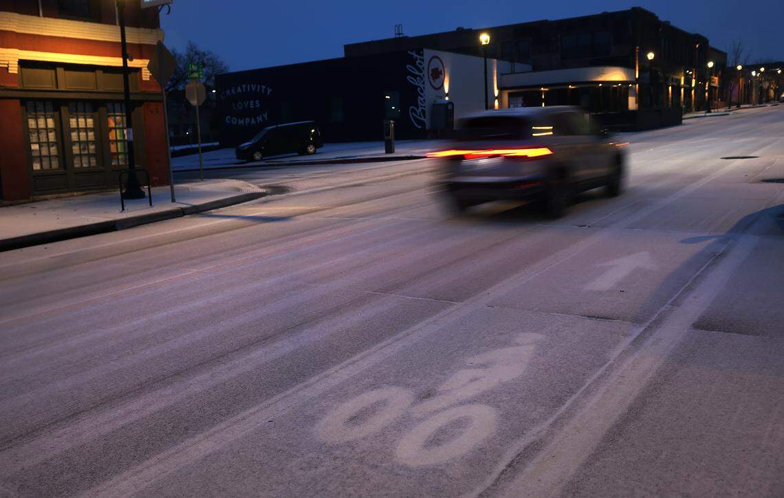 A mix of icy precipitation falls on South Main Street near downtown Fort Worth on Saturday morning, Jan. 24, 2026. A massive Arctic cold front is moving across North Texas, causing freezing temperatures.