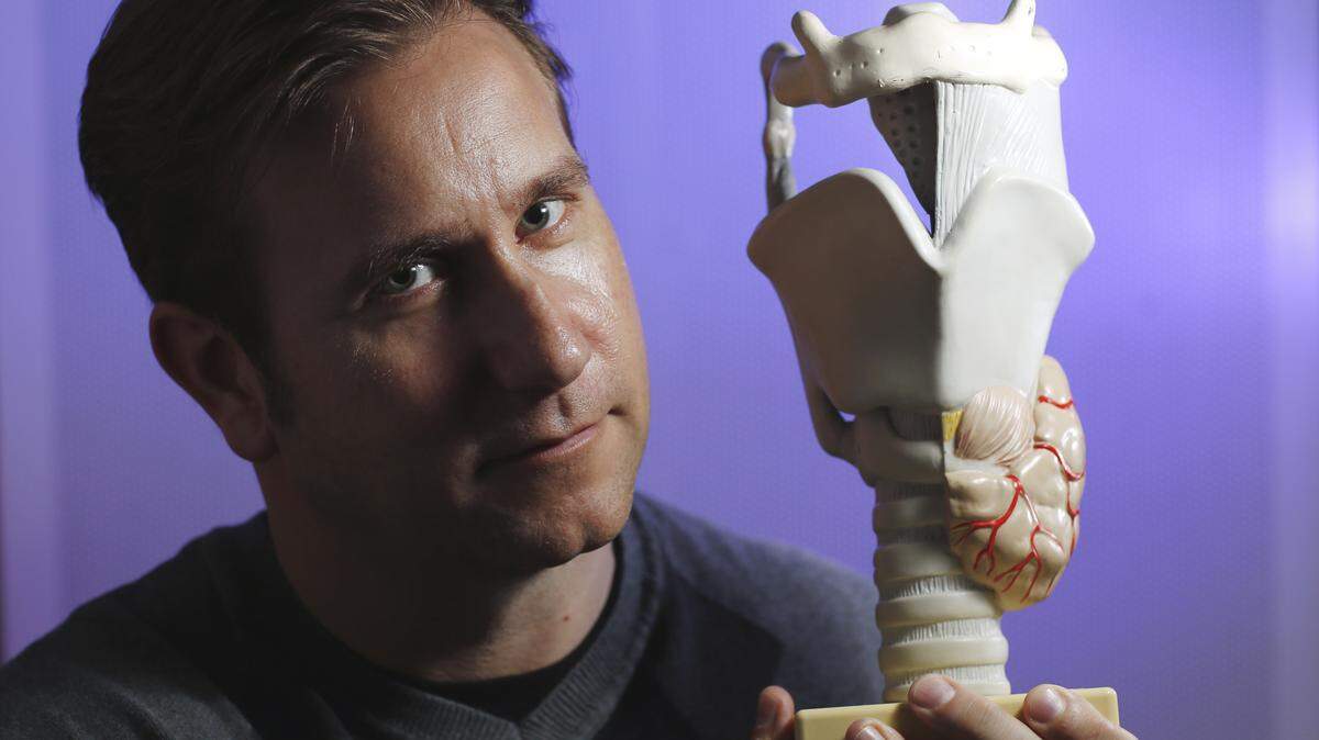 B 13-11-10 | Christopher Watts, professor and chair of the department of communication sciences and disorders in TCU's Harris College of Nursing and Health Sciences, holds an enlarged model of the human larynx. Photo by Carolyn Cruz, October 2013.