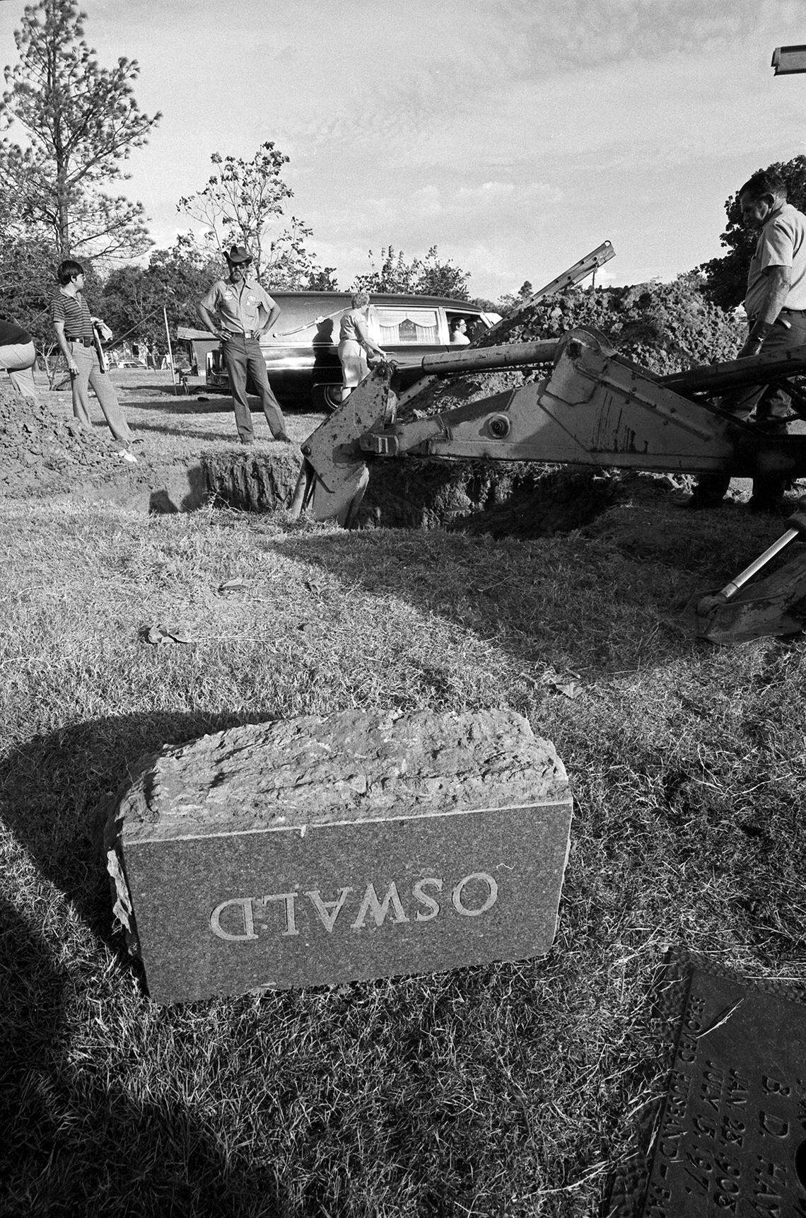 Oct. 4, 1981: The casket containing Lee Harvey Oswald’s remains for 18 years was exhumed and moved into the privacy of a tent at Rose Hill Memorial Park in Fort Worth before it was taken to Dallas for an autopsy. A bulldozer is seen digging into the grave and the gravestone is seen upside down.