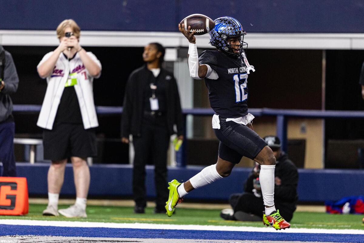 North Crowley quarterback Chris Jimerson (12) runs the ball in for a touchdown in the first quarter of the UIL 6A Division I championship game at AT&T Stadium in Arlington on Saturday, Dec. 21, 2024.