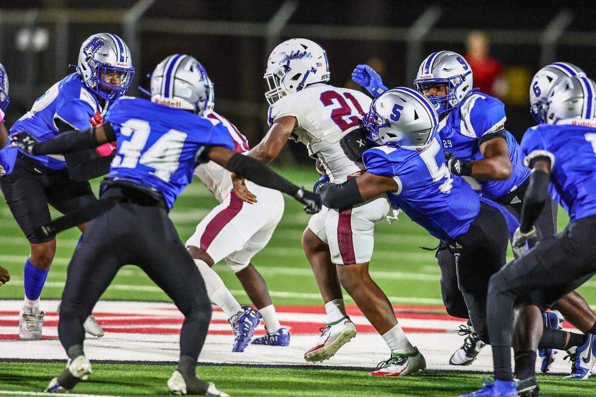 Fort Worth Southwest quarterback Zachariah Cain is tackled by Fort Worth Eastern Hills’ R.J. Medlock-Porter (5) on Thursday, Oct. 17, 2024 at Scarborough-Handley Field in Fort Worth, Texas.
