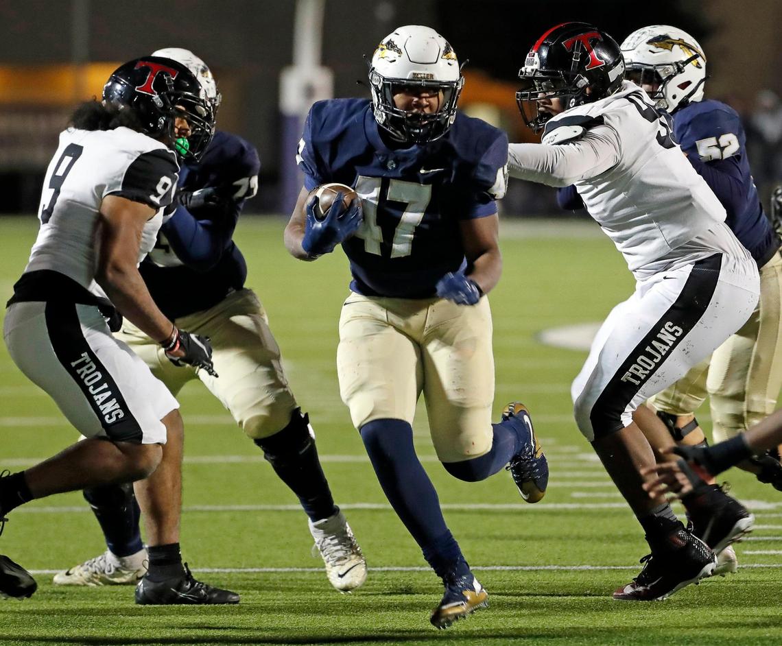 Keller running back Jayden Hart (47) runs up the middle in the second half of a Class 6A D1 bi-district football game between Keller and Euless Trinity at Keller ISD Stadium in Keller, Texas, Friday, Nov. 11, 2022. Keller defeated Trinity 17-10 to move on in the playoffs. Temperature at game time was 39 degrees. (Special to the Star-Telegram Bob Booth)