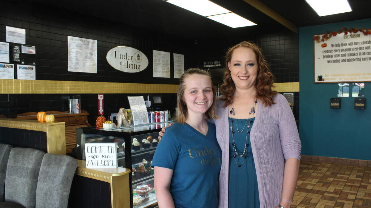 Under the Icing general manager Tristen McKenzie, left, and Ginger Midkiff, right, have watched the build-your-own cupcake shop grow from an idea to a community fixture in southwest Arlington.