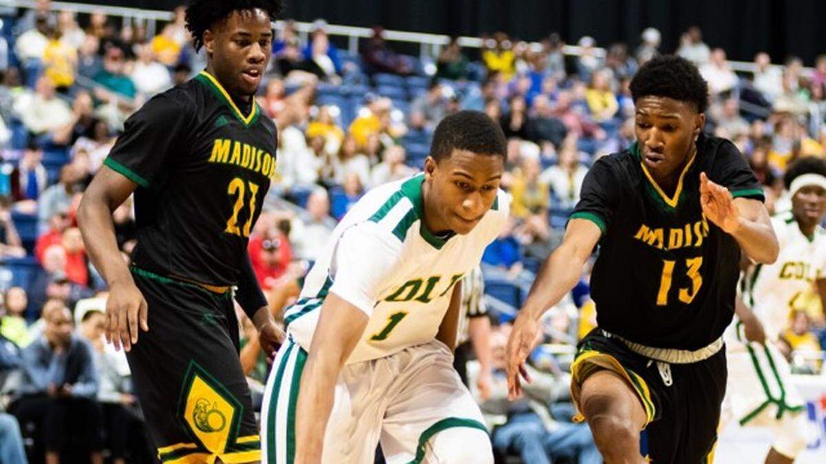 San Antonio Cole’s Xavier Epps dribbles away from Dallas Madison defenders Derrious Kinney (left) and Jody Legans in a 3A state semifinal game at the Alamodome, Thursday March 7, 2019.