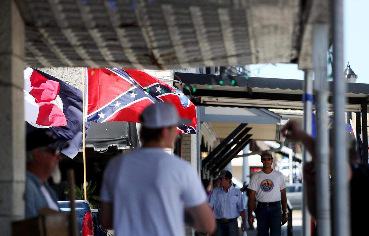 People who support the Confederate statue on the Parker County Courthouse lawn gather on Saturday, August 8, 2020, in downtown Weatherford after rumors a protest against the statue would take place spread on social media.