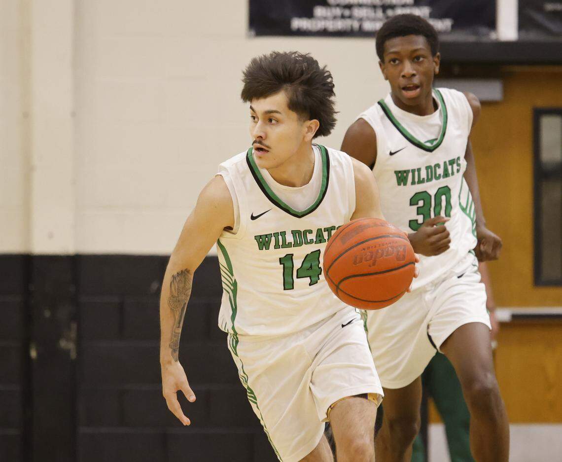 Kennedale shooting guard Jayden Mancha (14) brings the ball down court during the first half of a UIL boys basketball game between Alvarado and Kennedale at Kennedale High School in Kennedale, Texas, Tuesday Jan. 13, 2026