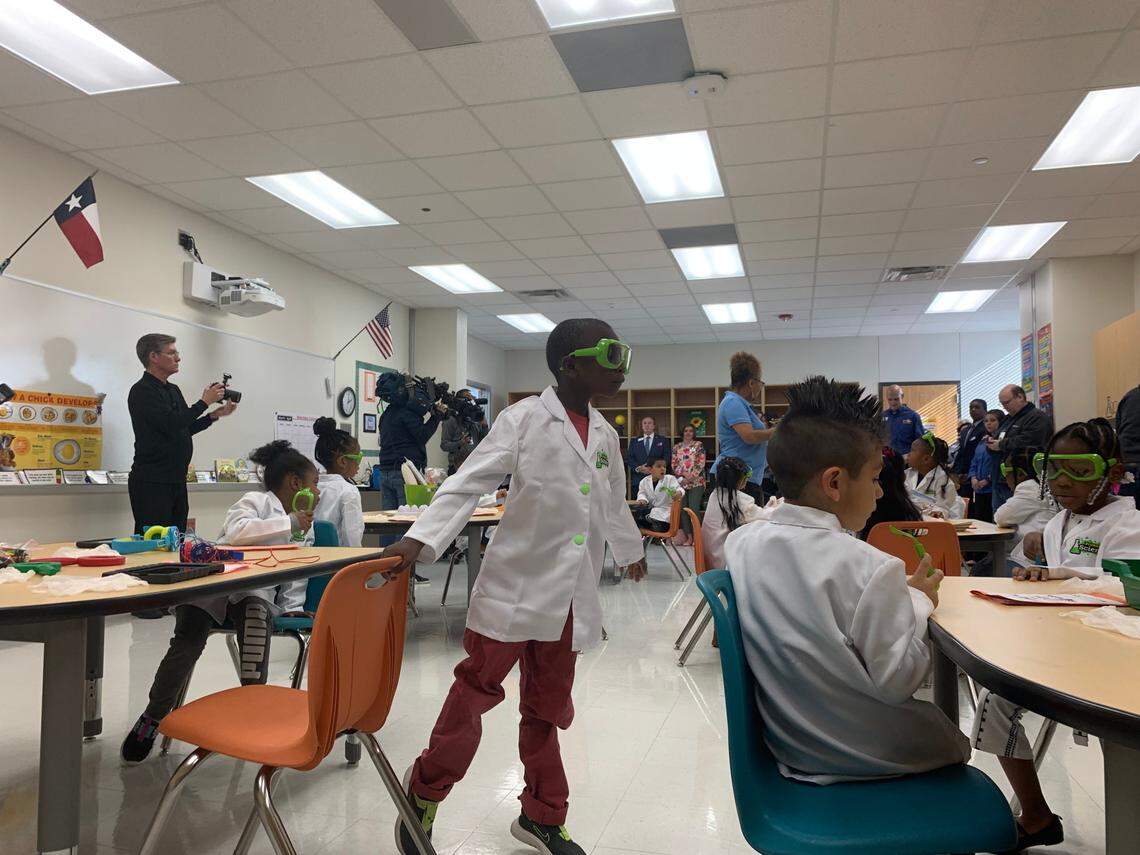 Zymir Hammonds looks over at Ian Casares during class on March 24. Pre-K is expanding next year to all 4-year-olds in Arlington ISD.