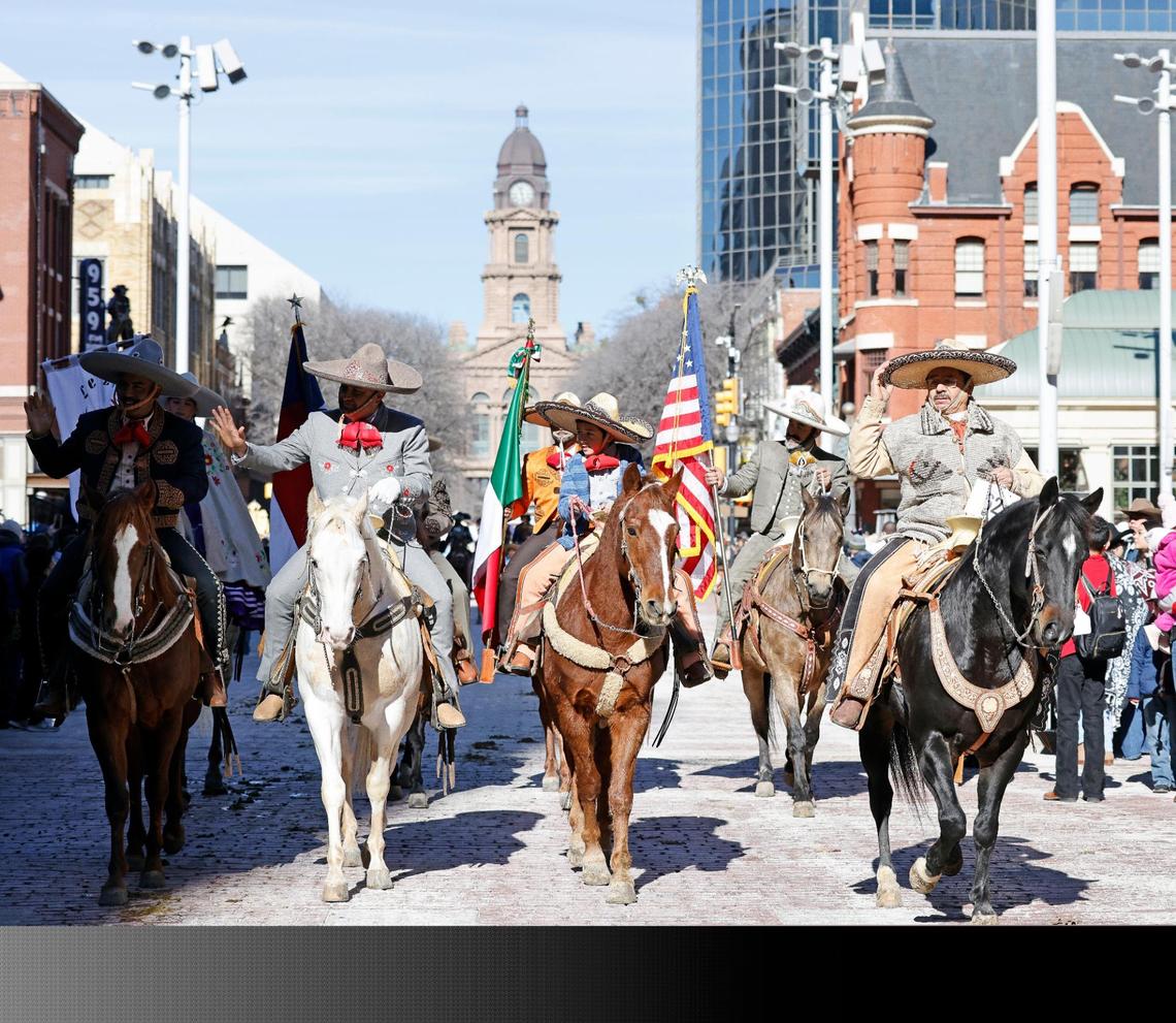 Vaqueros make their way through Sundance Square during the Fort Worth Stock Show and Rodeo parade in Fort Worth, Texas, Saturday, Jan, 13, 2024. (Special to the Star-Telegram Bob Booth)