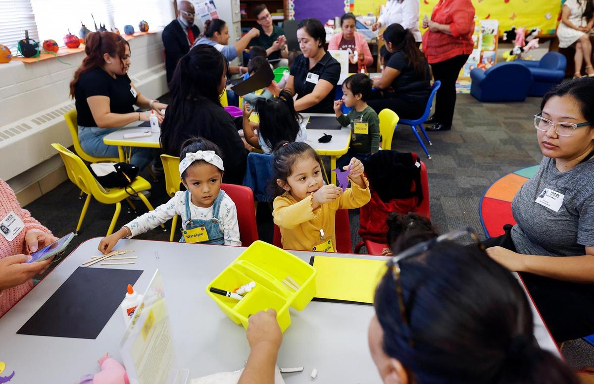 Parents and children attend a Zero to Five class on Wednesday, at M.H. Moore Elementary School in Fort Worth. The free Fort Worth ISD program provides educational classes to prepare parents and their children for pre-K and a classroom environment.