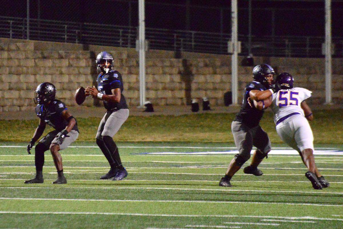 Mansfield Summit quarterback Demarus Bird looks to pass against Everman on Thursday, Oct. 31, 2024 at Newsom Stadium in Mansfield, Texas.