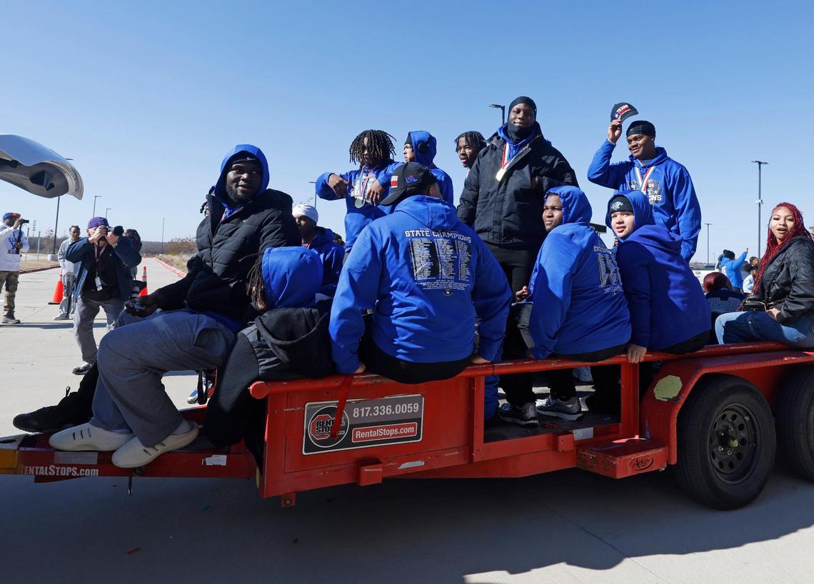 North Crowley football players pass by fans during the UIL 6A D1 Championship Parade at Crowley ISD Multi-purpose Stadium in North Crowley, Texas, on Saturday, Jan. 18, 2025.