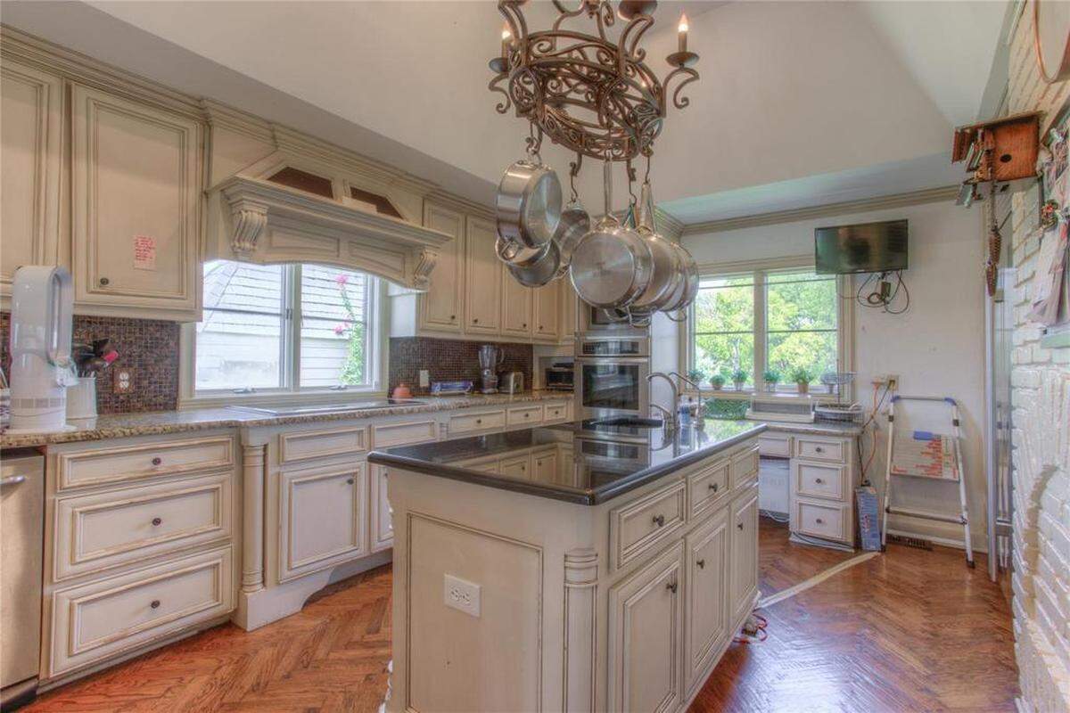 An updated kitchen from the 1970 French traditional style Eagle Mountain Lake home.