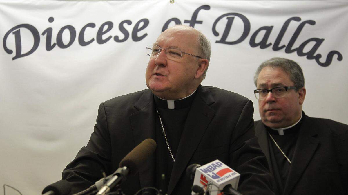 In this file photo, Bishop Kevin J. Farrell, of Dallas, (left) and Bishop Michael Olson, of Fort Worth, hold a press conference at the Catholic Diocese of Dallas to explain the response of Catholic Charities to the problem of unaccompanied minors flooding across the border, Monday, July 21, 2014.